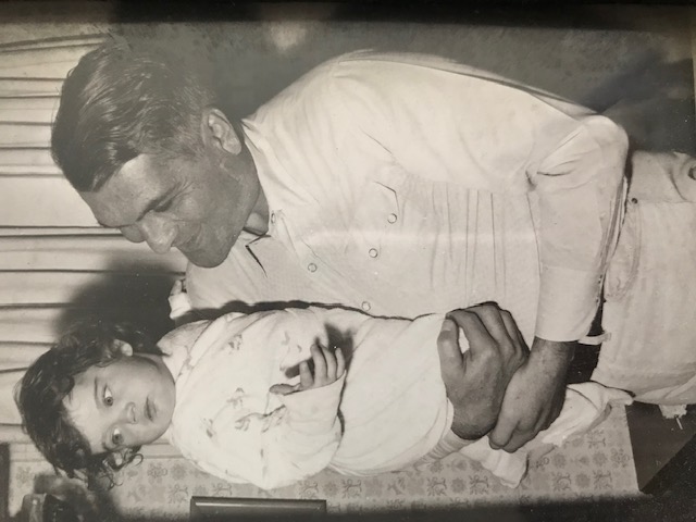 Patty Meyer's father holding her as a baby